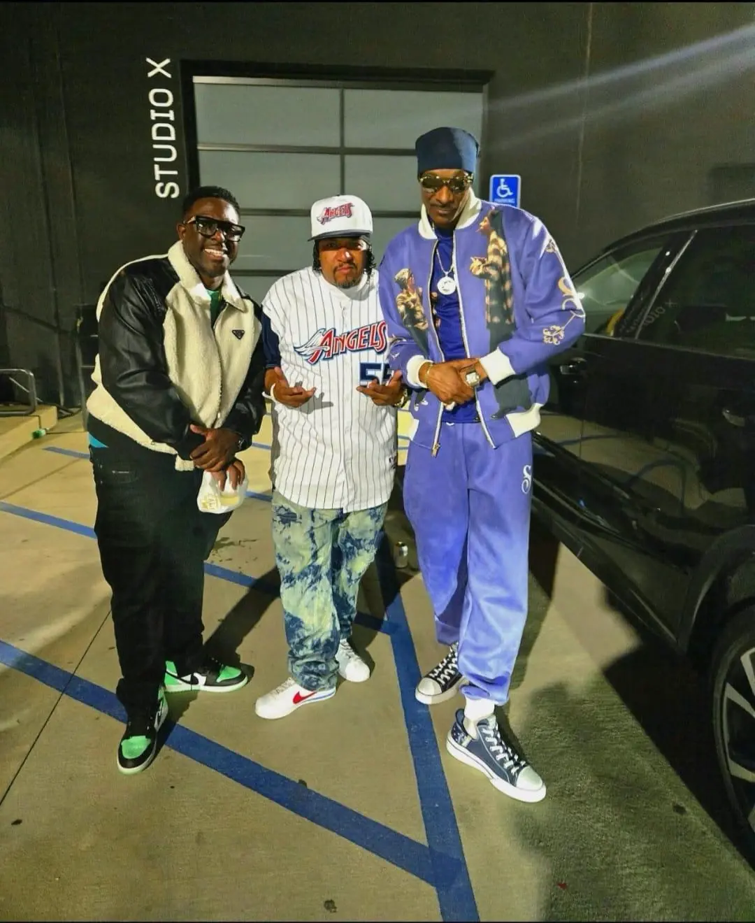 Frank “Nitty” Gibson Jr. with two others outside Studio X