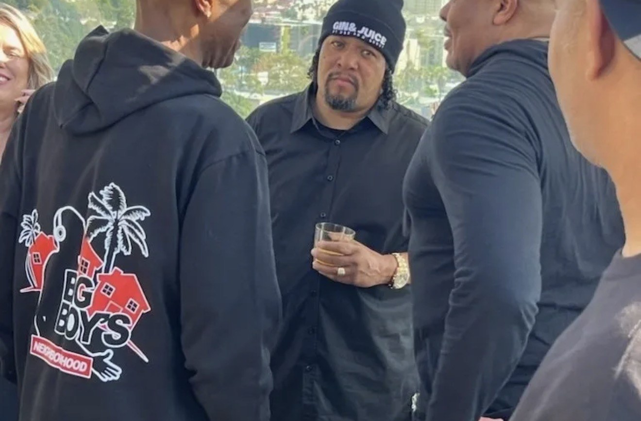 Frank “Nitty” Gibson Jr. in conversation at an outdoor gathering